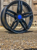 NEW 17 INCH ROMAC VENOM ALLOY WHEELS IN GLOSS BLACK 5x112
